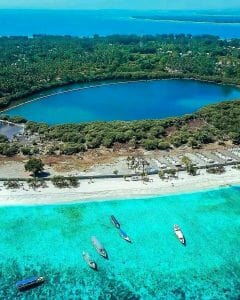 Scenic aerial view of Lombok with lake, beaches, and boats.