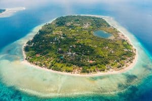 Aerial view of Gili Islands with lush greenery and surrounding turquoise waters.